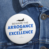 "Beware The Arrogance Of Excellence" Badge Pin