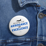 "Beware The Arrogance Of Excellence" Badge Pin